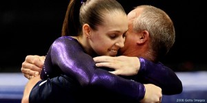 PHILADELPHIA - JUNE 22: Chellsie Memmel gets a hug from her coach and father Andy Memmel after competing on the balance beam during day four of the 2008 U.S. Olympic Team Trials for gymnastics at the Wachovia Center on June 22, 2008 in Philadelphia, Pennsylvania. (Photo by Al Bello/Getty Images)